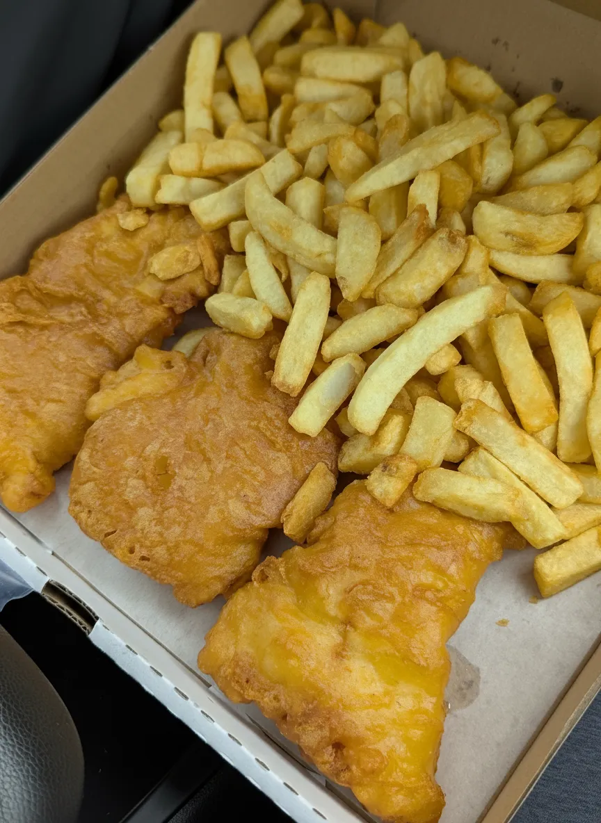 Fish and chips in a cardboard takeaway box