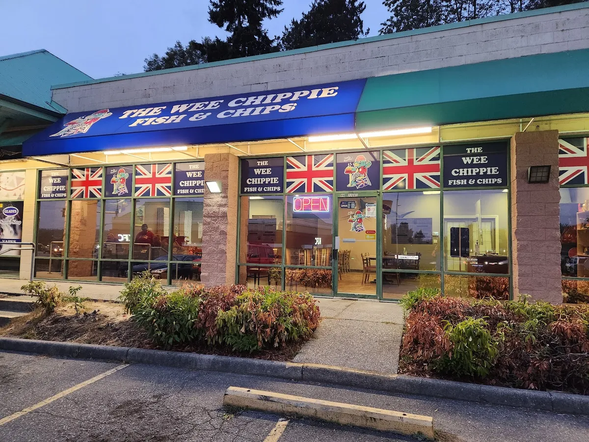 The Wee Chippie Fish & Chips storefront at dusk